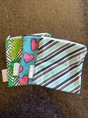 Itzy Ritzy Three-Pack Zipper Pouches in Teal, Pink, Green